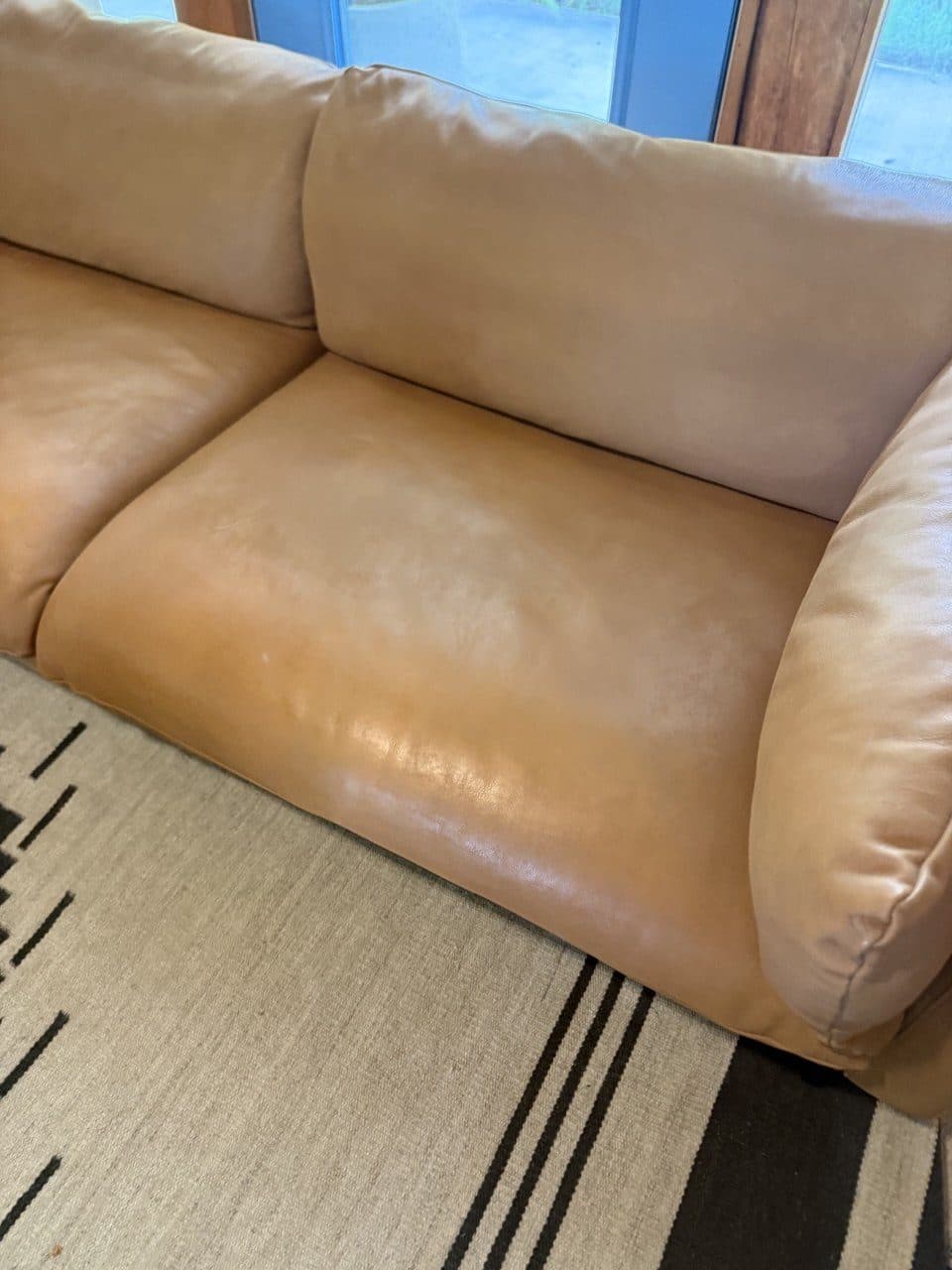 After: The same seat with the stain drawn out and the color restored over it