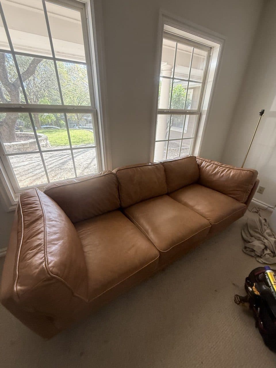 After: The same couch with the cushions restuffed and the line straight again