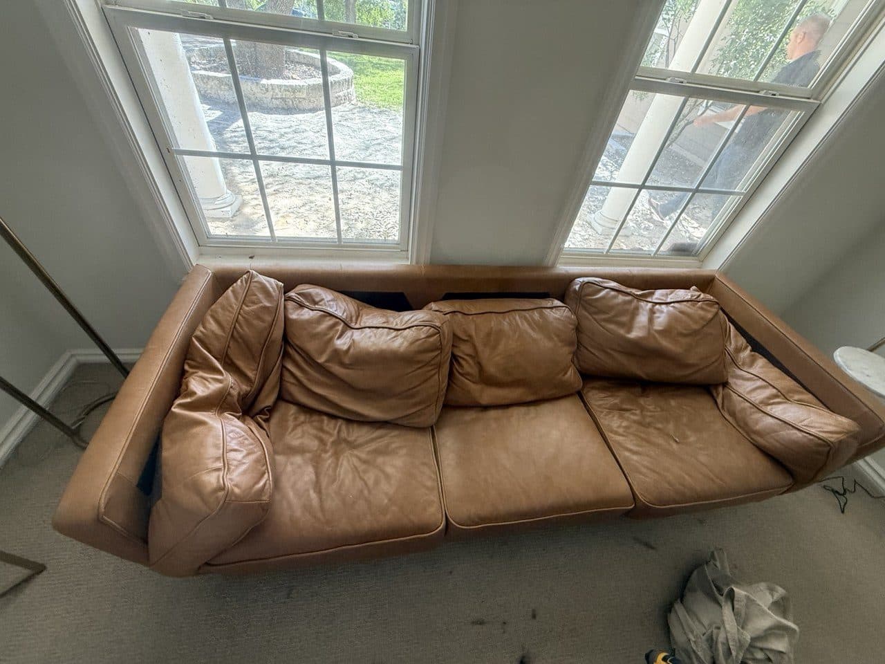 Before: Leather couch sagging through the middle of the seat